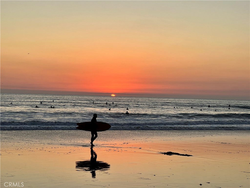 Surfer at sunset off Capistrano Beach